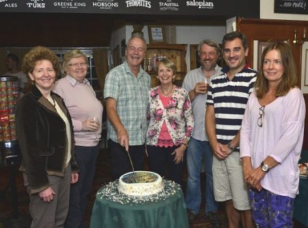Wace Morgan senior staff pictured cutting the celebration cake, from left: Fiona Barnes, Debby Gittins, Jeremy Taylor, Diana Packwood, Keir Hirst, Chris Detheridge and Zara Oliver.